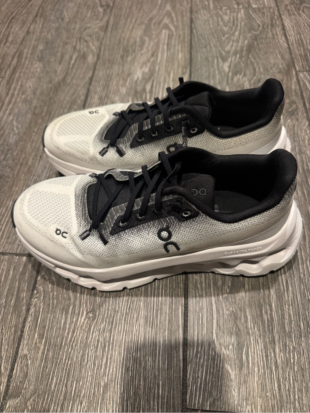 On Running Women's White and Black Cloudrunner Sneakers